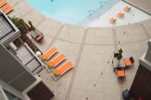 The Edge Luxury Apartments in Tulsa installed Bomanite Exposed Aggregate Alloy System Concrete Pool Deck