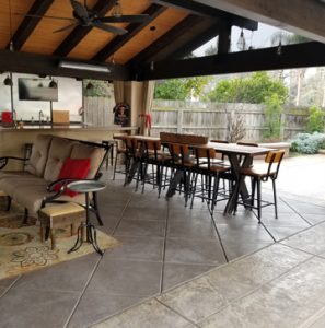 Bomanite Designer Backyard Ideal for Enterntaining with Imprinted Concrete Pool Deck and Exposed Aggregate Antico Firepit Seating and Cabana Flooring