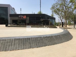 LAFC Stadium Los Angeles Futbol Club inspired by Bomanite Exposed Aggregate Systems Sandscape Texture and Bomanite Alloy Paving and Walkways with a specialty Flight Wall and Rooftop Deck created for Fans