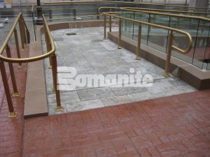 Connecticut Bomanite Installs Bomanite Basketweave Brick and Bomacron Medium Ashlar Slate Patterns to Replace Old Worn out Pavers in this Commerical Plaza and Pedestrian Bridge.