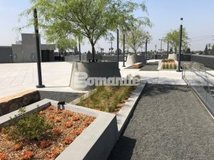 LAFC Stadium Los Angeles Futbol Club inspired by Bomanite Exposed Aggregate Systems Sandscape Texture and Bomanite Alloy Paving and Walkways with a specialty Flight Wall and Rooftop Deck created for Fans