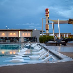 Hard Rock Casino located in Tulsa, OK makes waves with Bomanite Exposed Aggregate Alloy Finish for the Stylish, Architectural Concrete Pool Deck in two Bomanite Color Hardener and Integral Color Geometric shapes installed by Bomanite of Tulsa, Inc.