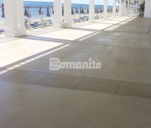 The Westchester Country Club Beach Club chose to install a platinum product from the Bomanite Exposed Aggregate System using Bomanite Revealed in two colors with stone and glass aggregates created durable walkways for the outdoor application installed by Beyond Concrete out of Keyport, NJ
