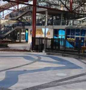 St. Louis Aquarium at Union Station Creates River of Glass with Bomanite Revealed Exposed Aggregate for the River Confluence created by PGAV Destinations and installed by Musselman & Hall Contractors for the Aquarium Train Station Themed Entry Way