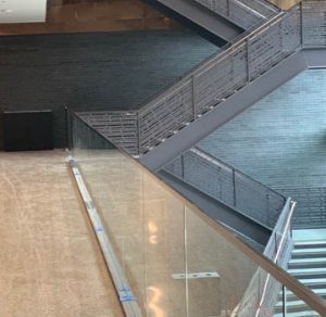 Dallas Holocaust and Human Rights Museum moves into their newly built facility designed by Omniplan with an industrial modern Bomanite polished concrete floor installed by Texas Bomanite