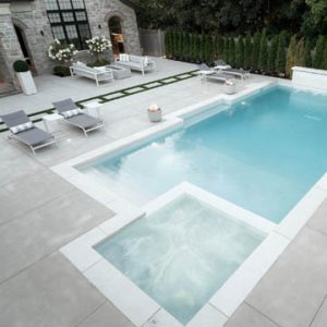 The Homeowners sought out Bomanite Toronto in Canada for a sleek backyard pool deck using the Bomanite Sandscape Refined Exposed Aggregate System