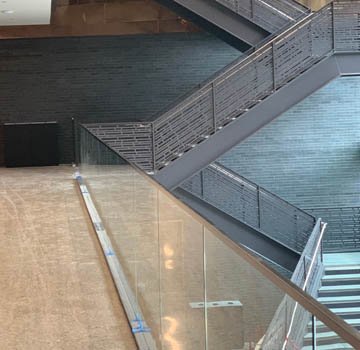 Dallas Holocaust and Human Rights Museum moves into their newly built facility designed by Omniplan with an industrial modern Bomanite polished concrete floor installed by Texas Bomanite