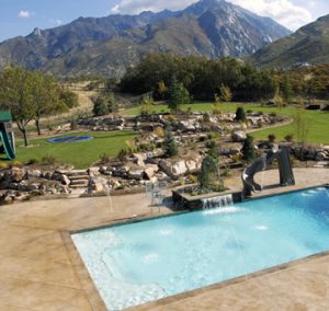 Architectural Concrete and Design Installed this Nature Inspired Patio, Pool Deck, Fire Pit and Stairs in a Beautiful Stamped Concrete Slate Texture