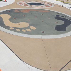 Musselman & Hall Contractors, LLC finished the work needed on the Community Park in Jefferson City, Mo with colorful concrete using the Bomanite Sandscape Texture Exposed Aggregate System with Bomanite Con-Color for a fun splash pad for everyone to enjoy.