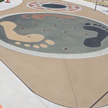 Musselman & Hall Contractors, LLC finished the work needed on the Community Park in Jefferson City, Mo with colorful concrete using the Bomanite Sandscape Texture Exposed Aggregate System with Bomanite Con-Color for a fun splash pad for everyone to enjoy.