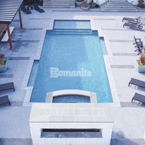 Bomanite Licensee Bomanite of Tulsa installed over 2,500 SF of Bomanite Revealed and Bomanite Alloy to create decorative concrete pool decking for homeowners.