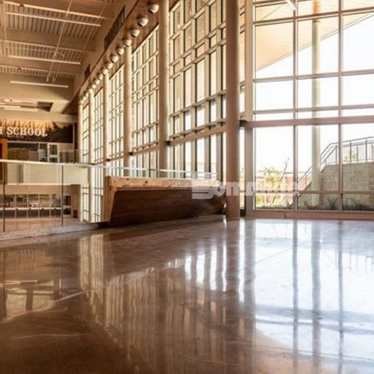 Texas Bomanite installed 243,000 SF of polished concrete flooring, including 9,165 SF of flooring with large aggregate exposure and custom glass aggregates at Lake Belton High School.