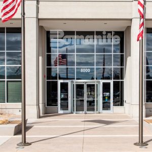 Bomanite Sandscape Texture and Bomanite Sandscape Refined were installed here to create the decorative concrete paved office building entry and planter walls.