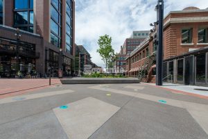 McGregor Square outdoor plaza boasts beautiful installation of Bomanite Custom Polished Concrete benches and Sandscape Texture splashpad.