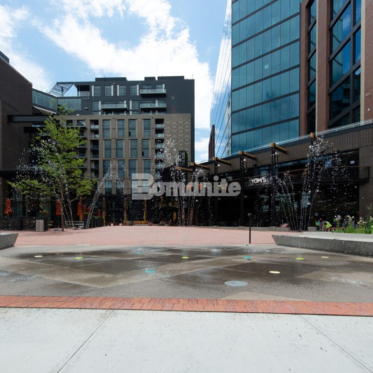 McGregor Square outdoor plaza boasts beautiful installation of Bomanite Custom Polished Concrete benches and Sandscape Texture splashpad