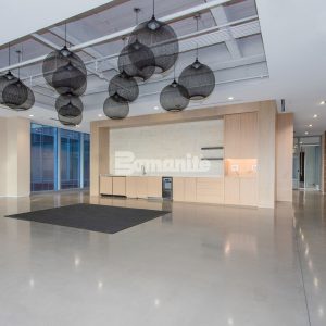 The Healthpeak Properties office in the Denver Tech Center boasts a beautiful Bomanite Modena Monolithic custom polished overlay with uniform aggregate exposure.