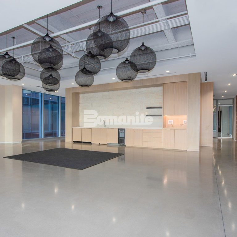 The Healthpeak Properties office in the Denver Tech Center boasts a beautiful Bomanite Modena Monolithic custom polished overlay with uniform aggregate exposure.