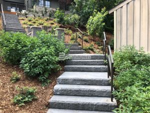 Concrete Arts installed Bomanite Regular Slate Texture decorative concrete on residential backyard steps in Hudson, WI.