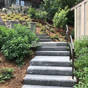 Residential backyard steps in Hudson, WI, features Bomanite Regular Slate Texture decorative concrete installed by Concrete Arts.