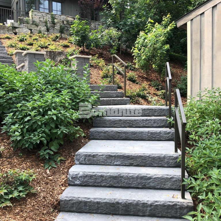 Residential backyard steps in Hudson, WI, features Bomanite Regular Slate Texture decorative concrete installed by Concrete Arts.