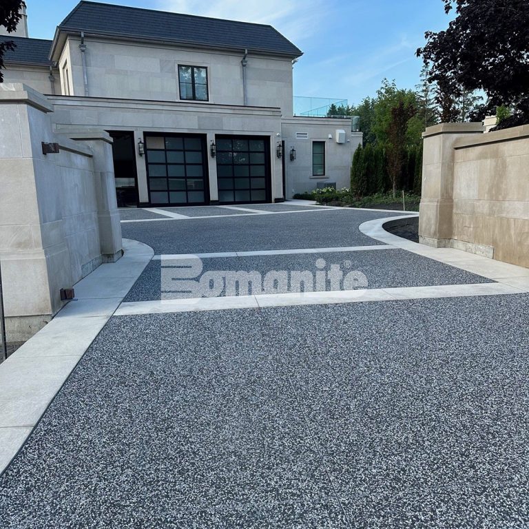 A residential driveway in Toronto, Canada, features Bomanite Sandscape decorative concrete installed by Bomanite Toronto.