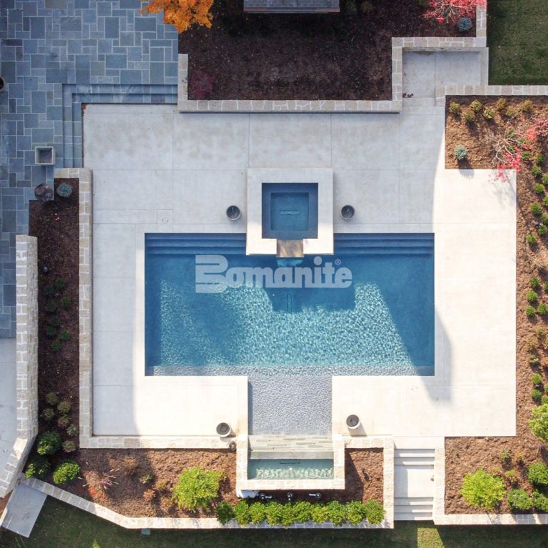 Pool deck using Bomanite Exposed Aggregate System and Bomanite Antico in Bomanite Coquina installed by Bomanite of Tulsa.Pool deck using Bomanite Exposed Aggregate System and Bomanite Antico in Bomanite Coquina installed by Bomanite of Tulsa.