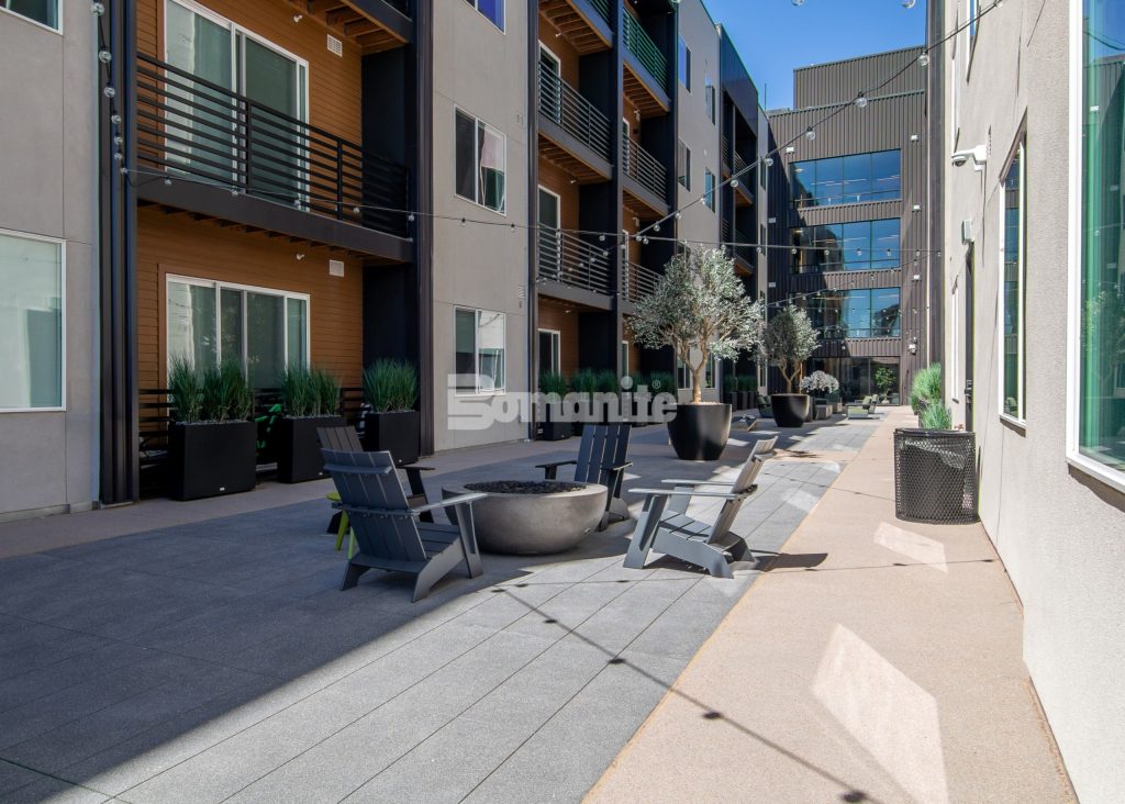 Bomanite Sandscape Texture at Enso Zen Apartments installed by Colorado Hardscapes in Denver, CO.