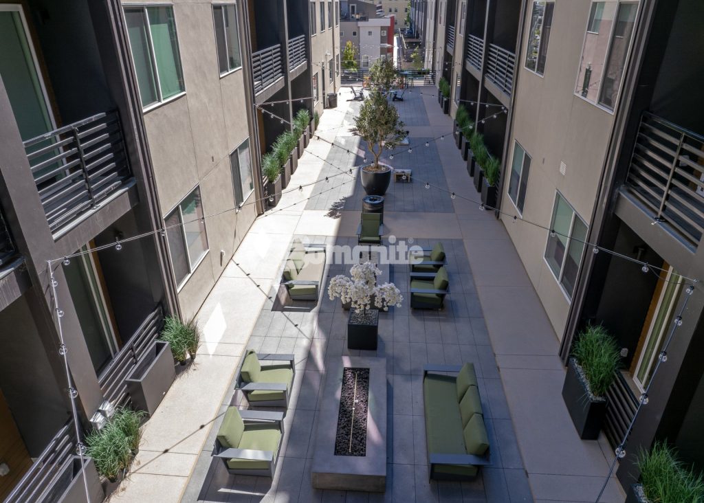 Bomanite Sandscape Texture at Enso Zen Apartments installed by Colorado Hardscapes in Denver, CO.