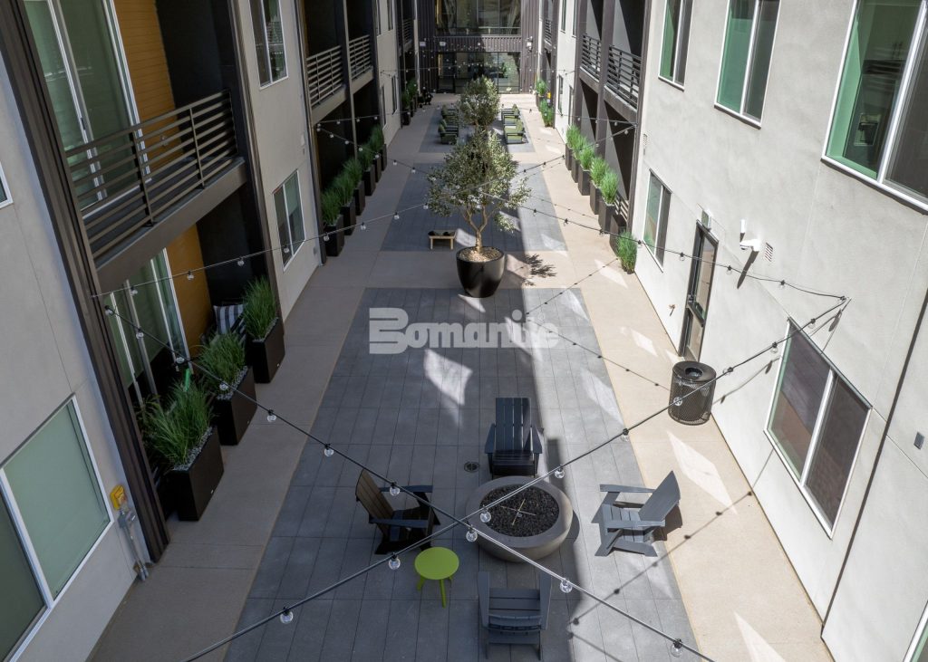 Bomanite Sandscape Texture at Enso Zen Apartments installed by Colorado Hardscapes in Denver, CO.