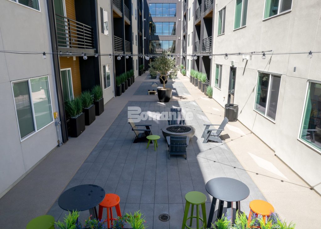 Bomanite Sandscape Texture at Enso Zen Apartments installed by Colorado Hardscapes in Denver, CO.