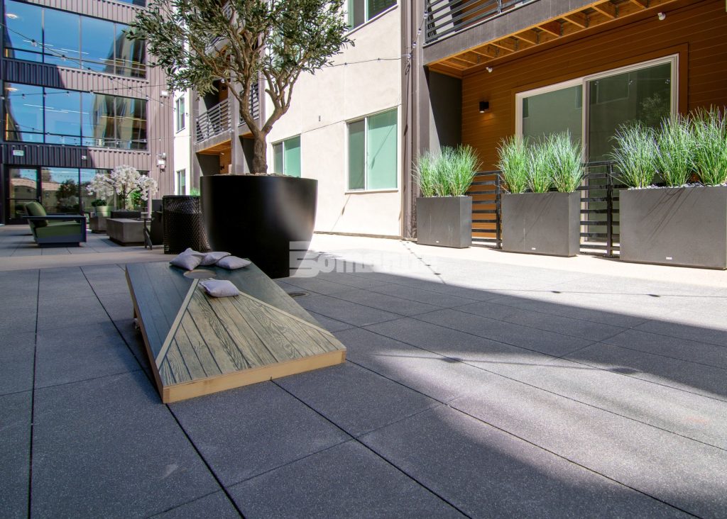 Bomanite Sandscape Texture at Enso Zen Apartments installed by Colorado Hardscapes in Denver, CO.