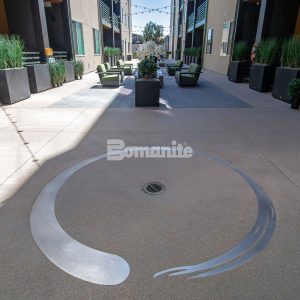 Bomanite Sandscape Texture at Enso Zen Apartments installed by Colorado Hardscapes in Denver, CO.
